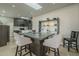 Kitchen features a skylight, a breakfast bar island with seating, and stainless steel appliances at 6366 N 19Th St, Phoenix, AZ 85016