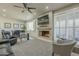 Open-concept living room with a cozy fireplace and natural lighting at 6366 N 19Th St, Phoenix, AZ 85016