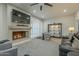 Open-concept living room with a cozy fireplace and natural lighting at 6366 N 19Th St, Phoenix, AZ 85016