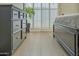 Bright bedroom boasts wood floors, plantation shutters, and a black dresser to complete the decor at 6366 N 19Th St, Phoenix, AZ 85016