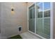 Outdoor patio area with sliding glass door access and pet door at 6366 N 19Th St, Phoenix, AZ 85016