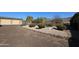 Landscaped backyard with gravel and mountain views at 6416 W Parkside Ln, Glendale, AZ 85310