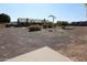 Expansive backyard with gravel landscaping and a view of the home at 6416 W Parkside Ln, Glendale, AZ 85310