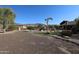 Landscaped backyard with gravel and trees at 6416 W Parkside Ln, Glendale, AZ 85310