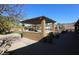 Outdoor kitchen and pergola with seating area at 6416 W Parkside Ln, Glendale, AZ 85310