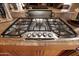 Stainless steel Thermador gas cooktop with five burners at 6416 W Parkside Ln, Glendale, AZ 85310