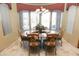 Bright dining area with granite table and wood chairs at 6416 W Parkside Ln, Glendale, AZ 85310