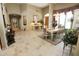 Open and bright dining room with a view of entry and living areas at 6416 W Parkside Ln, Glendale, AZ 85310