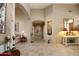 Elegant entry hall with tile flooring, decorative accents, and views to other rooms at 6416 W Parkside Ln, Glendale, AZ 85310