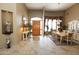 Inviting entryway with a wooden door and tile floors at 6416 W Parkside Ln, Glendale, AZ 85310