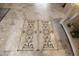 Intricate tile floor design in the entryway at 6416 W Parkside Ln, Glendale, AZ 85310