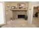 Stone fireplace creates a cozy atmosphere in the home office at 6416 W Parkside Ln, Glendale, AZ 85310