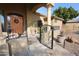 Elegant front entrance with ornate iron gate and tiled walkway at 6416 W Parkside Ln, Glendale, AZ 85310