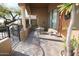 Spacious front patio with seating area and decorative plants at 6416 W Parkside Ln, Glendale, AZ 85310