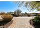 Brick pathway leading to a house with desert landscaping at 6416 W Parkside Ln, Glendale, AZ 85310