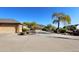 Landscaped front yard with long driveway, mature trees, and mountain views at 6416 W Parkside Ln, Glendale, AZ 85310