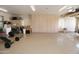 Spacious garage with ample storage and built-in cabinets at 6416 W Parkside Ln, Glendale, AZ 85310