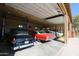 Garage with four car lifts, and vintage cars at 6416 W Parkside Ln, Glendale, AZ 85310