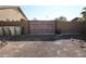 Automatic gate leading to a private backyard at 6416 W Parkside Ln, Glendale, AZ 85310