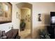 Bright hallway with decorative wall art and tile flooring at 6416 W Parkside Ln, Glendale, AZ 85310