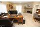 Home office features a stone fireplace and built-in shelving at 6416 W Parkside Ln, Glendale, AZ 85310