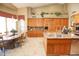 Spacious kitchen with island, granite countertops, and wood cabinets at 6416 W Parkside Ln, Glendale, AZ 85310