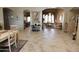 Open floor plan connecting the living and dining areas with tile flooring at 6416 W Parkside Ln, Glendale, AZ 85310