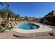 Resort-style pool with a waterfall and plenty of patio space for lounging at 6416 W Parkside Ln, Glendale, AZ 85310