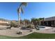 Landscaped pool area with palm trees at 6416 W Parkside Ln, Glendale, AZ 85310