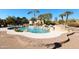 Relaxing pool area with waterfall and patio at 6416 W Parkside Ln, Glendale, AZ 85310