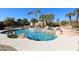 Large kidney shaped pool with waterfall feature at 6416 W Parkside Ln, Glendale, AZ 85310