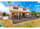 This backyard features a covered patio and grass area at 6422 W Garden Dr, Glendale, AZ 85304