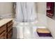 Corner bathtub offers a relaxing retreat in this well-lit bathroom at 6422 W Garden Dr, Glendale, AZ 85304