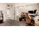 Bright and airy bedroom with soft lighting and ample space for a comfortable office setup at 6422 W Garden Dr, Glendale, AZ 85304