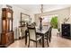 Elegant dining room featuring a chandelier, large window, and classic decor for memorable meals at 6422 W Garden Dr, Glendale, AZ 85304