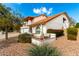 Beautiful home featuring colorful landscaping, a courtyard, and a spacious three-car garage at 6422 W Garden Dr, Glendale, AZ 85304