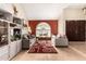 Bright living room featuring a vaulted ceiling, large windows, and stylish decor for comfortable living at 6422 W Garden Dr, Glendale, AZ 85304