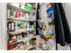 Pantry featuring organized shelving with an array of food items and storage solutions at 6422 W Garden Dr, Glendale, AZ 85304