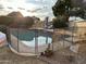 Private backyard pool with secure fencing, set in a landscaped yard with clear skies above at 6422 W Garden Dr, Glendale, AZ 85304