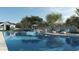 Resort-style pool with plenty of lounge chairs and umbrellas at 6450 E El Maro Cir, Paradise Valley, AZ 85253