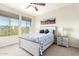 Bedroom with a ceiling fan and large windows at 6605 N 93Rd N Ave # 1082, Glendale, AZ 85305