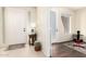 Bright entryway with tile floors, a coat closet, and access to other rooms at 6605 N 93Rd N Ave # 1082, Glendale, AZ 85305