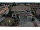 This is an aerial view of a two-story home in an established neighborhood at 7461 W Tumblewood Dr, Peoria, AZ 85382