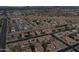 A high angle view of a community featuring a mix of homes and swimming pools at 7461 W Tumblewood Dr, Peoria, AZ 85382