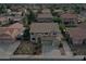 This is an aerial view of a two-story home with a well manicured lawn at 7461 W Tumblewood Dr, Peoria, AZ 85382