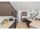 Well-lit kitchen featuring tile floors, gray cabinets, stainless steel appliances and breakfast bar at 7461 W Tumblewood Dr, Peoria, AZ 85382