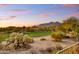 Peaceful backyard view with golf course and mountain views at sunset at 7500 E Boulders Pkwy # 11, Scottsdale, AZ 85266