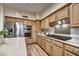 Modern kitchen features stainless steel appliances and light wood cabinets at 7500 E Boulders Pkwy # 11, Scottsdale, AZ 85266