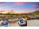 Relaxing patio with fire pit and comfortable seating, overlooking scenic views at 7500 E Boulders Pkwy # 11, Scottsdale, AZ 85266