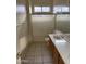 Clean bathroom, shower/tub combo and wood vanity at 7668 E Thunderhawk Rd, Scottsdale, AZ 85255